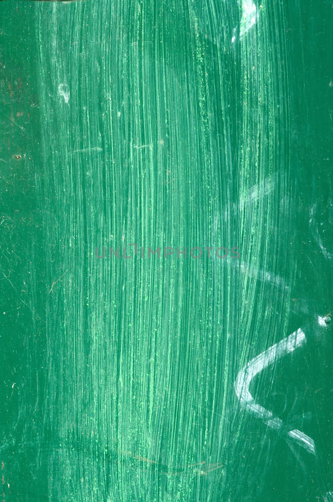 Green surface of metal plate with white lines.