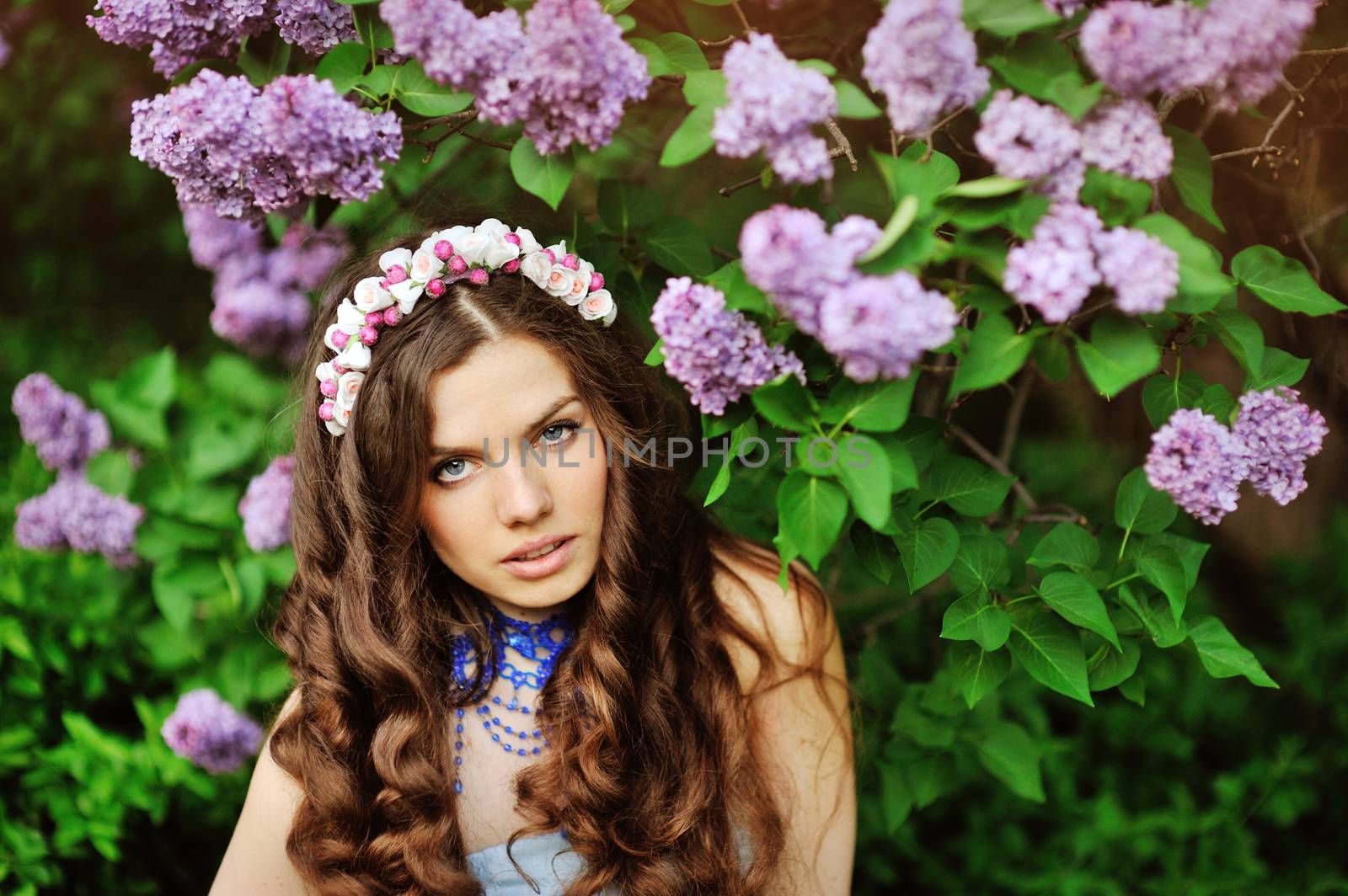 beautiful girl on a walk among the blooming trees by timonko