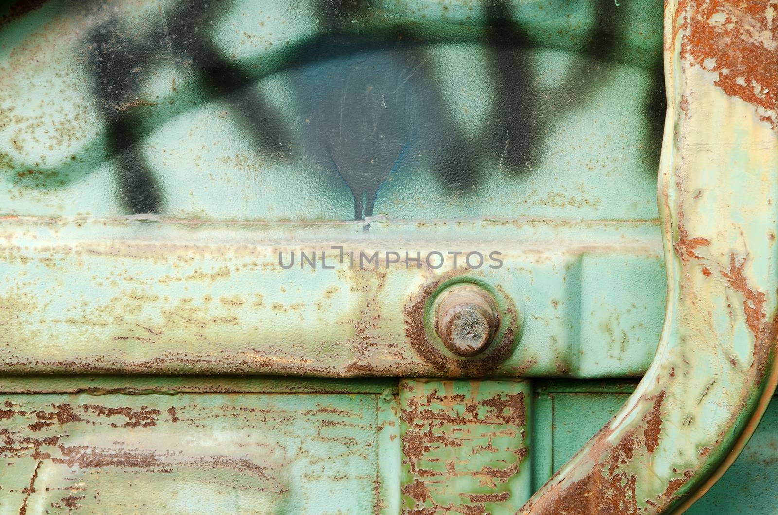 Detail of old rusty blue metal dust bin.