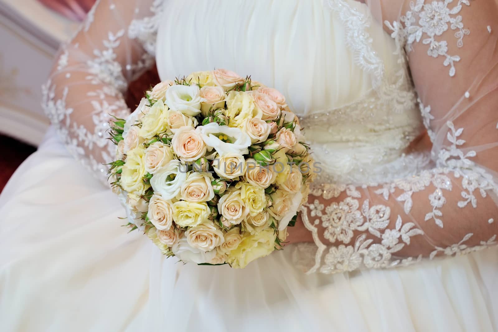 wedding bouquet in bride's hands.