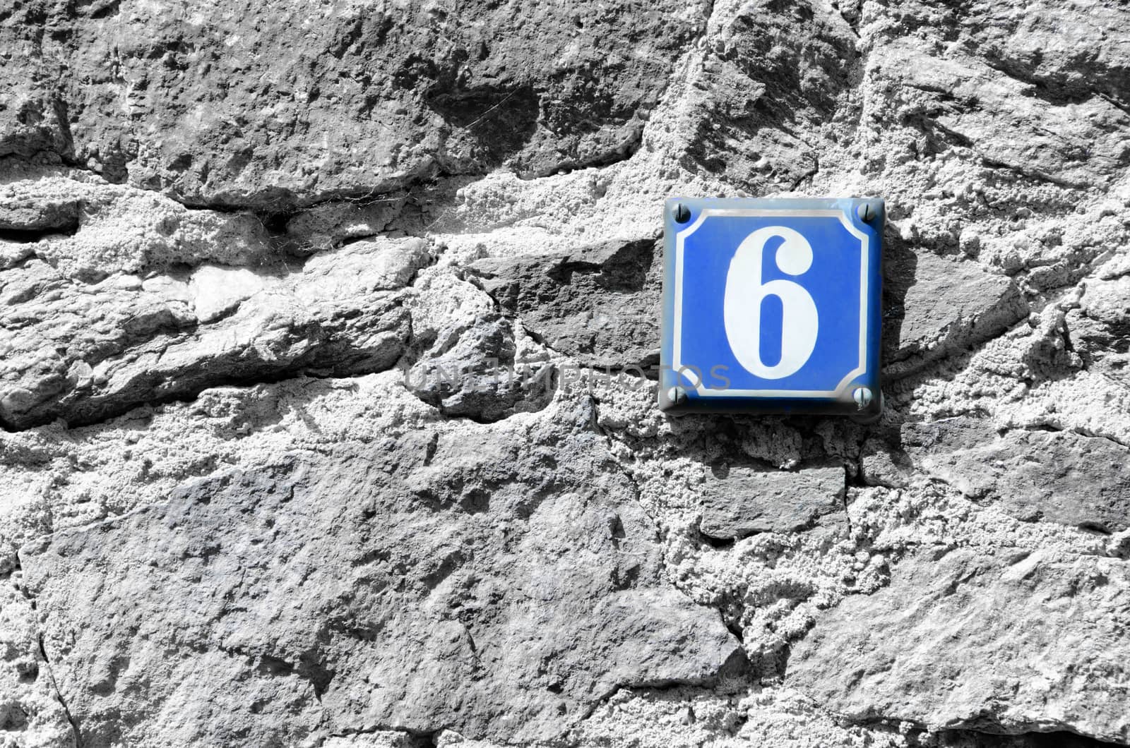 House number six on the blue board. 
