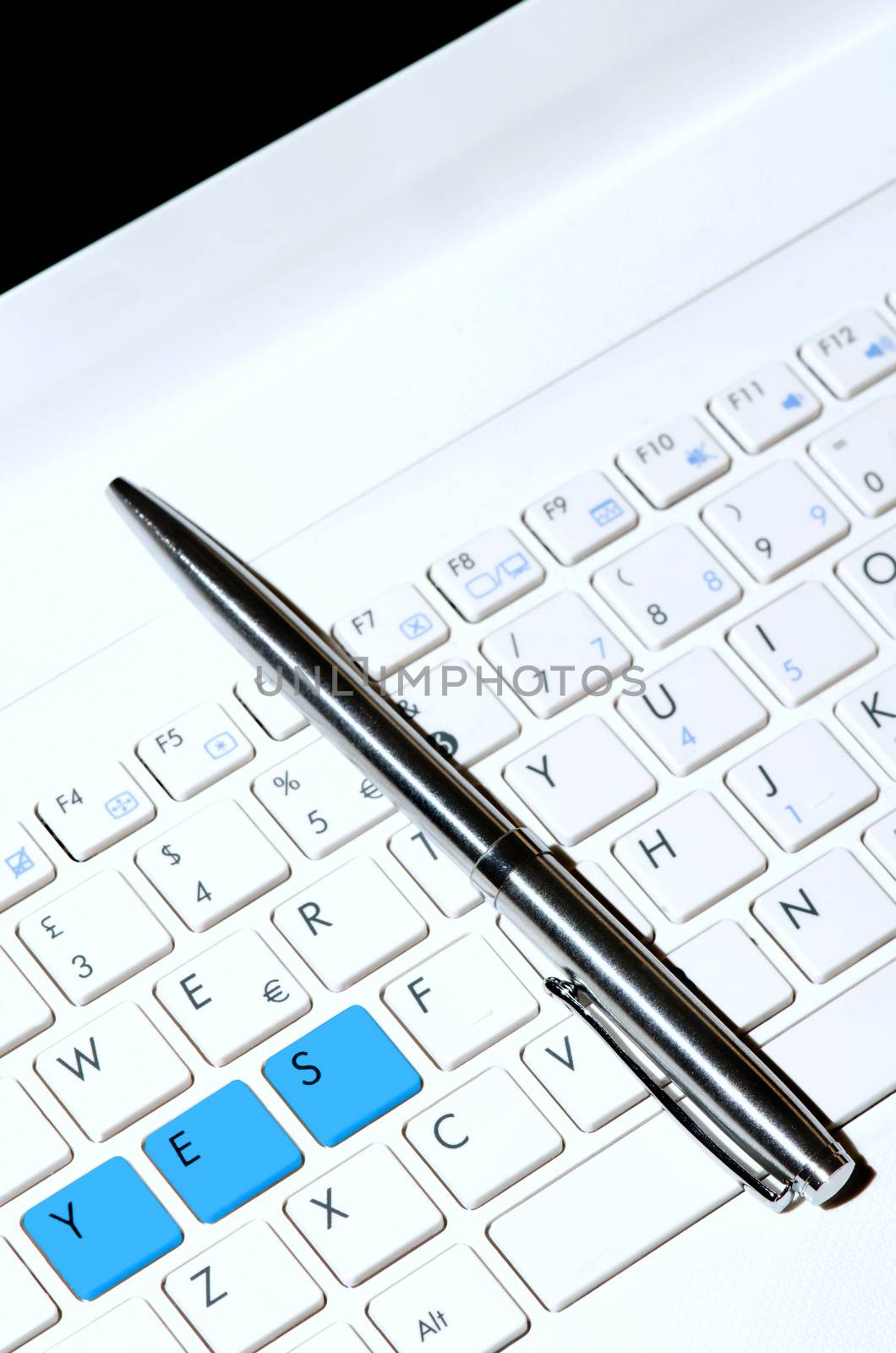 White keyboard as desicion making concept and pen. 