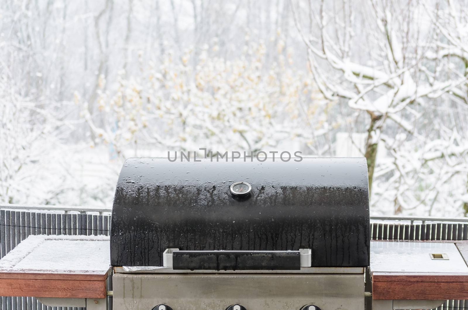 Barbecue grill in the winter on a balcony ready for winter grilling.