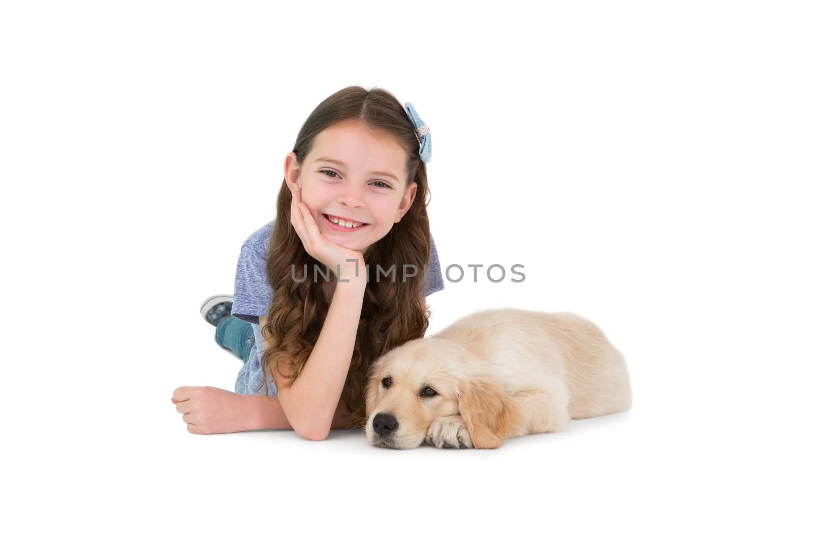 Lying little girl with a dog on white background 