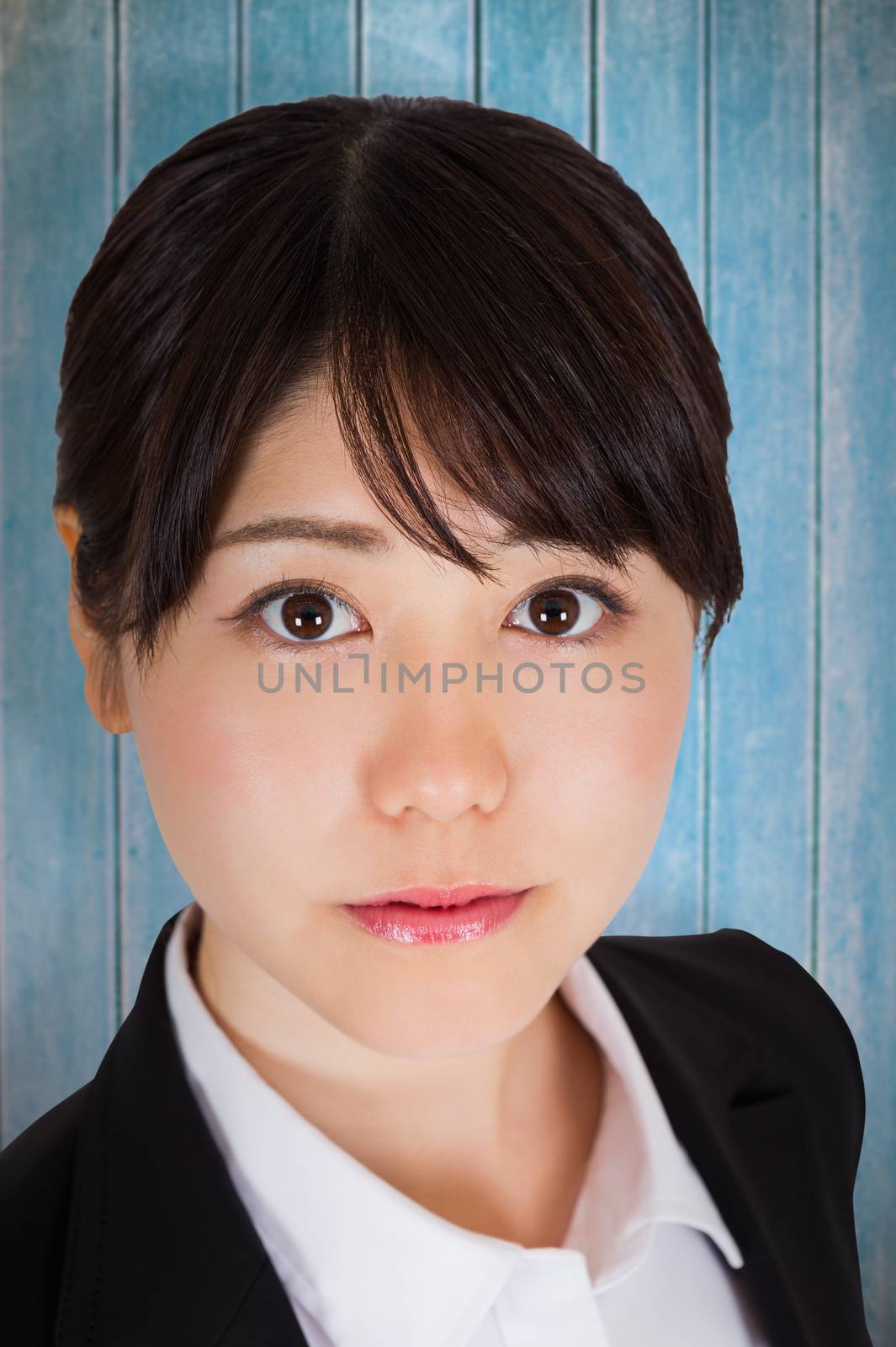 Composite image of serious businesswoman by Wavebreakmedia