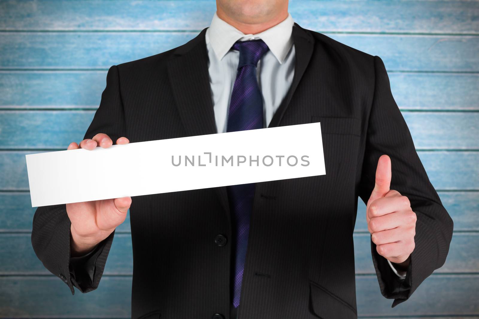 Composite image of businessman showing card by Wavebreakmedia