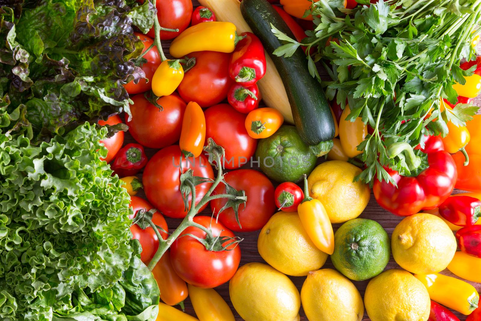 Fresh Organic Vegetables on Top of Wooden Table by coskun