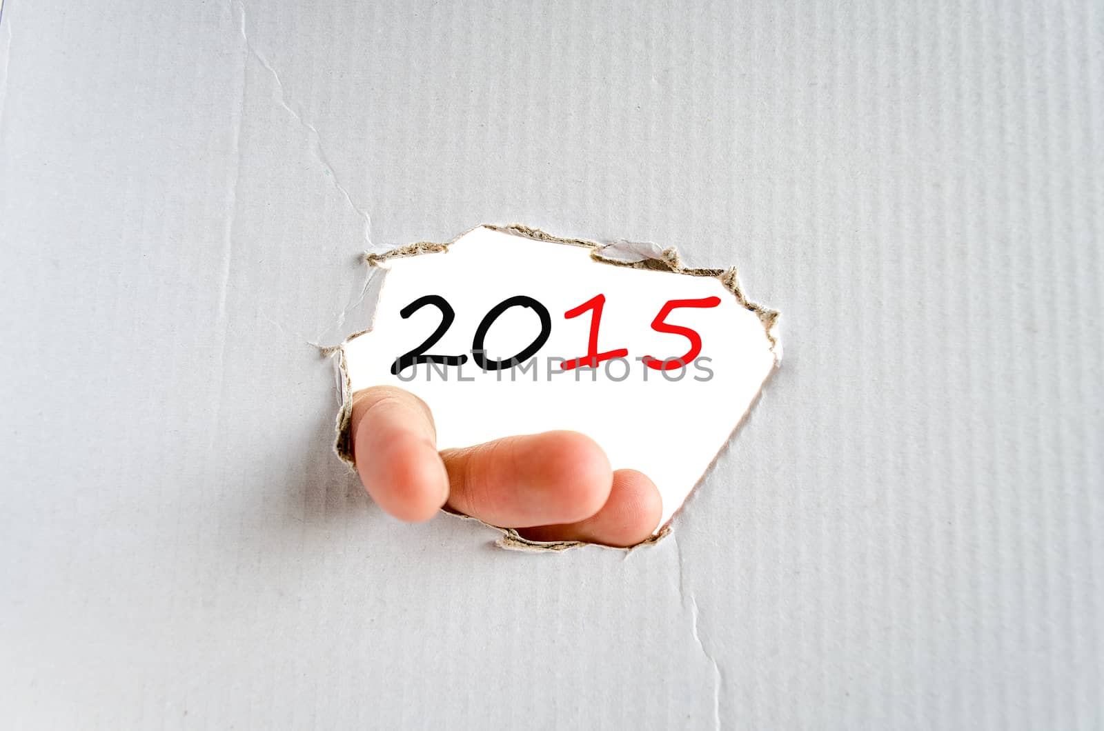 Hand on the cardboard background 2015 concept