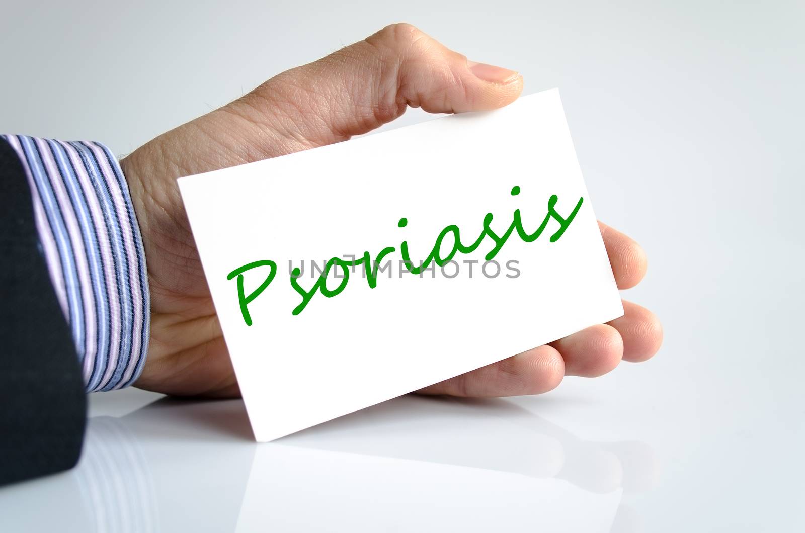 Psoriasis concept note in bussines man hand
