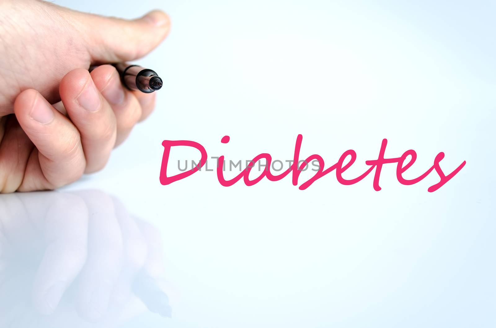 Pen in the hand isolated over white background diabetes concept