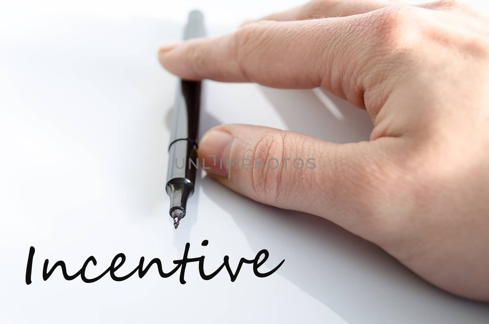 Pen in the hand isolated over white background incentive concept