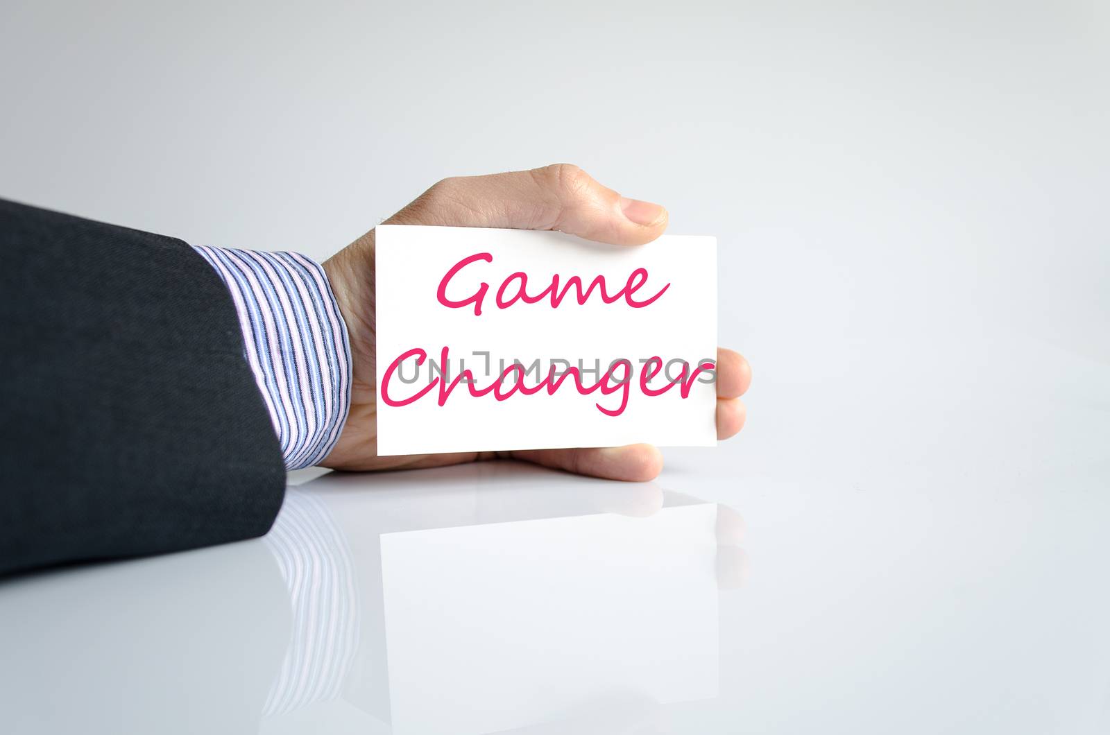 Bussines man hand writing game changer