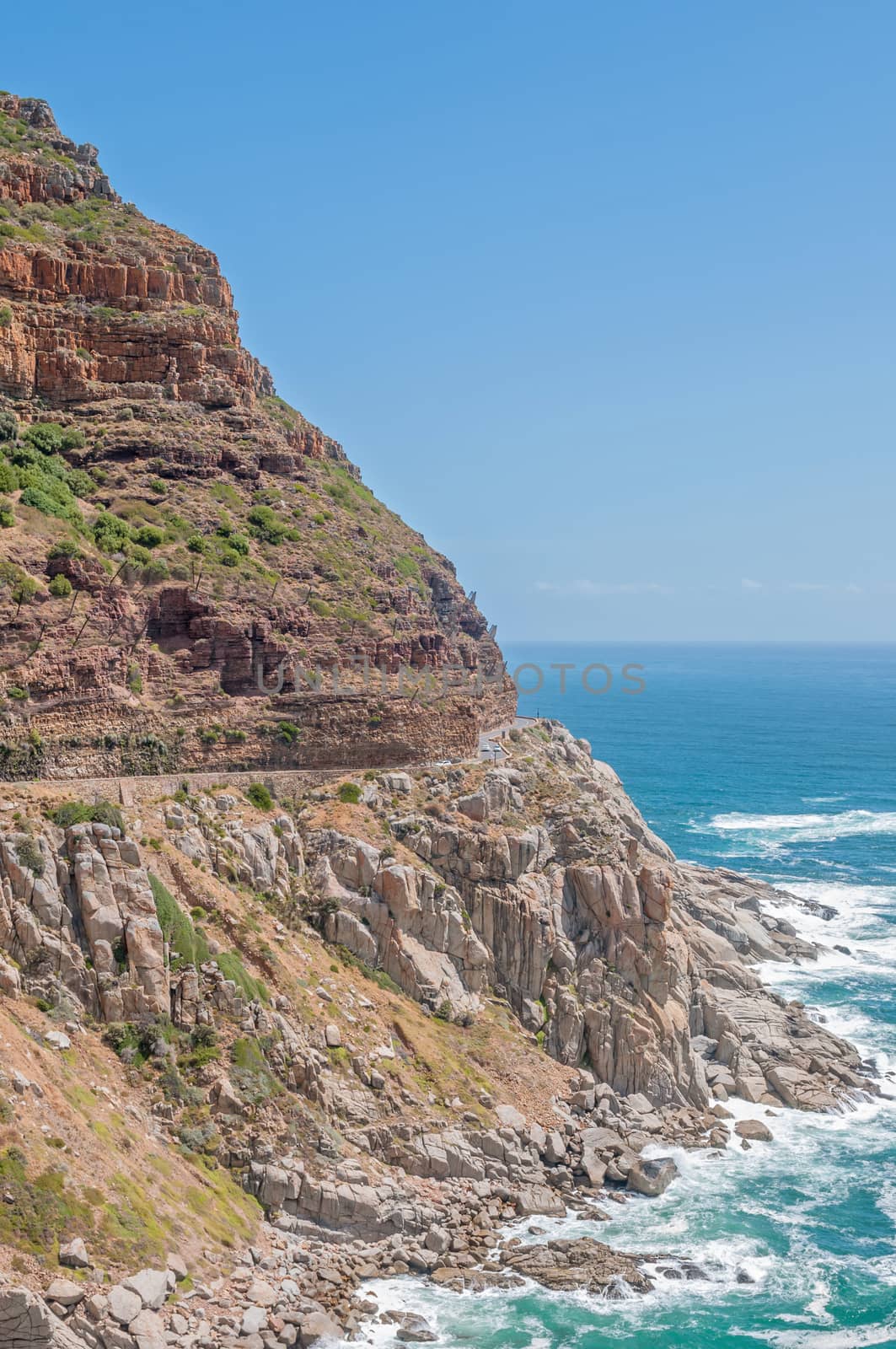 CAPE TOWN, SOUTH AFRICA - DECEMBER 12, 2014:  Chapmans Peak, a scenic drive between Noordhoek and Hout Bay. Nets to catch falling rocks are visible