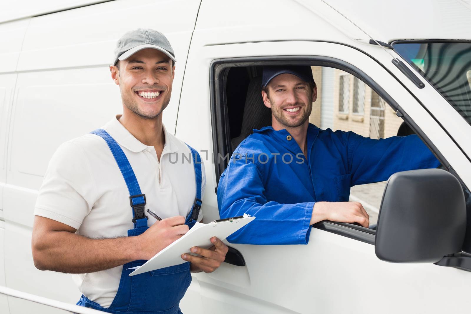 Delivery man getting signature from customer on white background