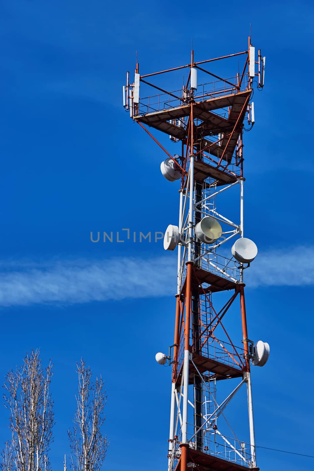 Cell tower on a background of blue sky                               
