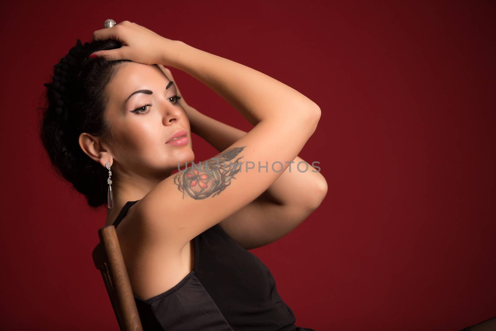 Portrait of beautiful female model on red background