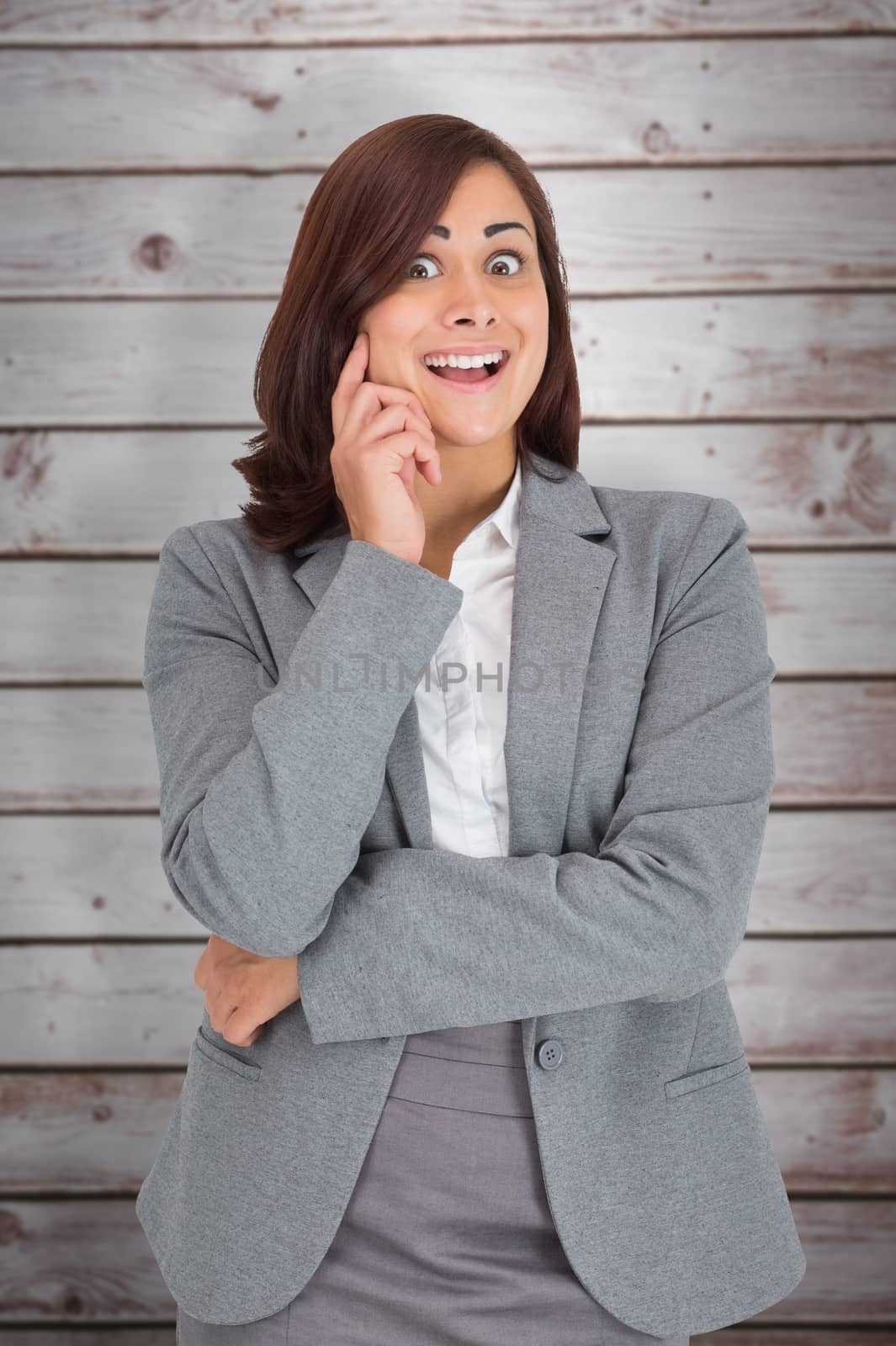 Pretty businesswoman thinking against wooden planks