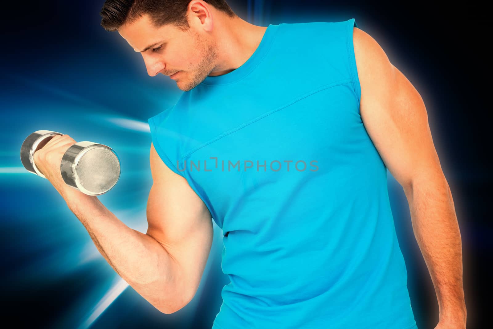 Fit young man exercising with dumbbell against abstract background