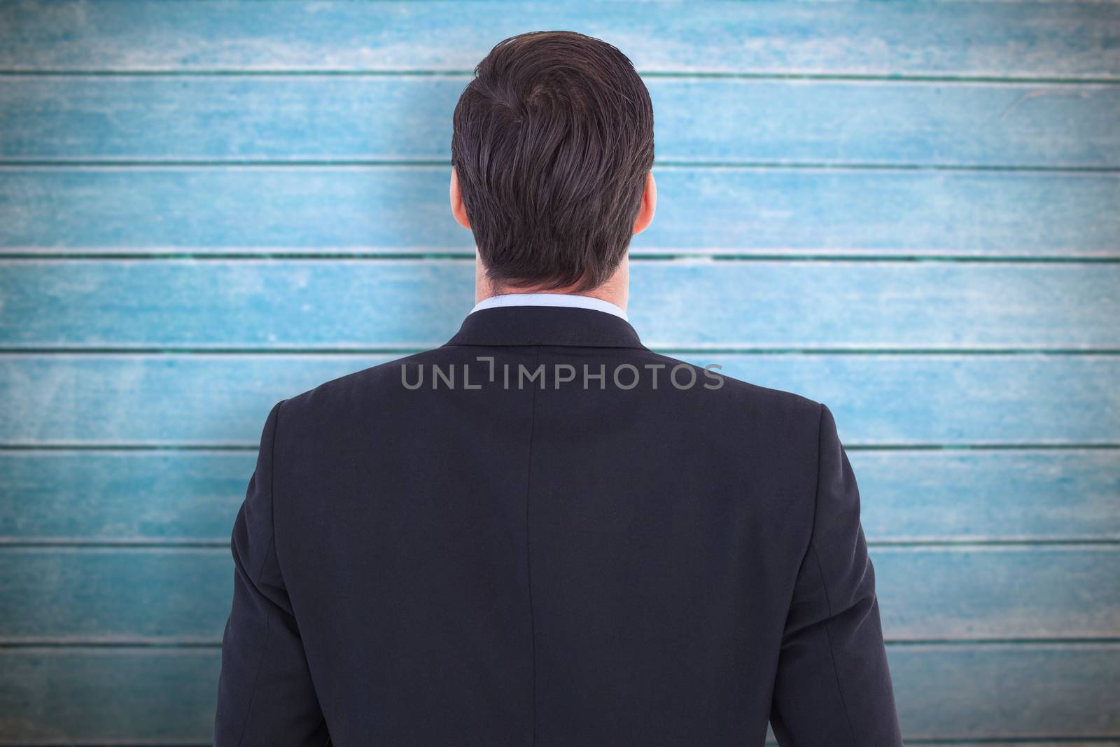 Composite image of rear view of handsome businessman  by Wavebreakmedia