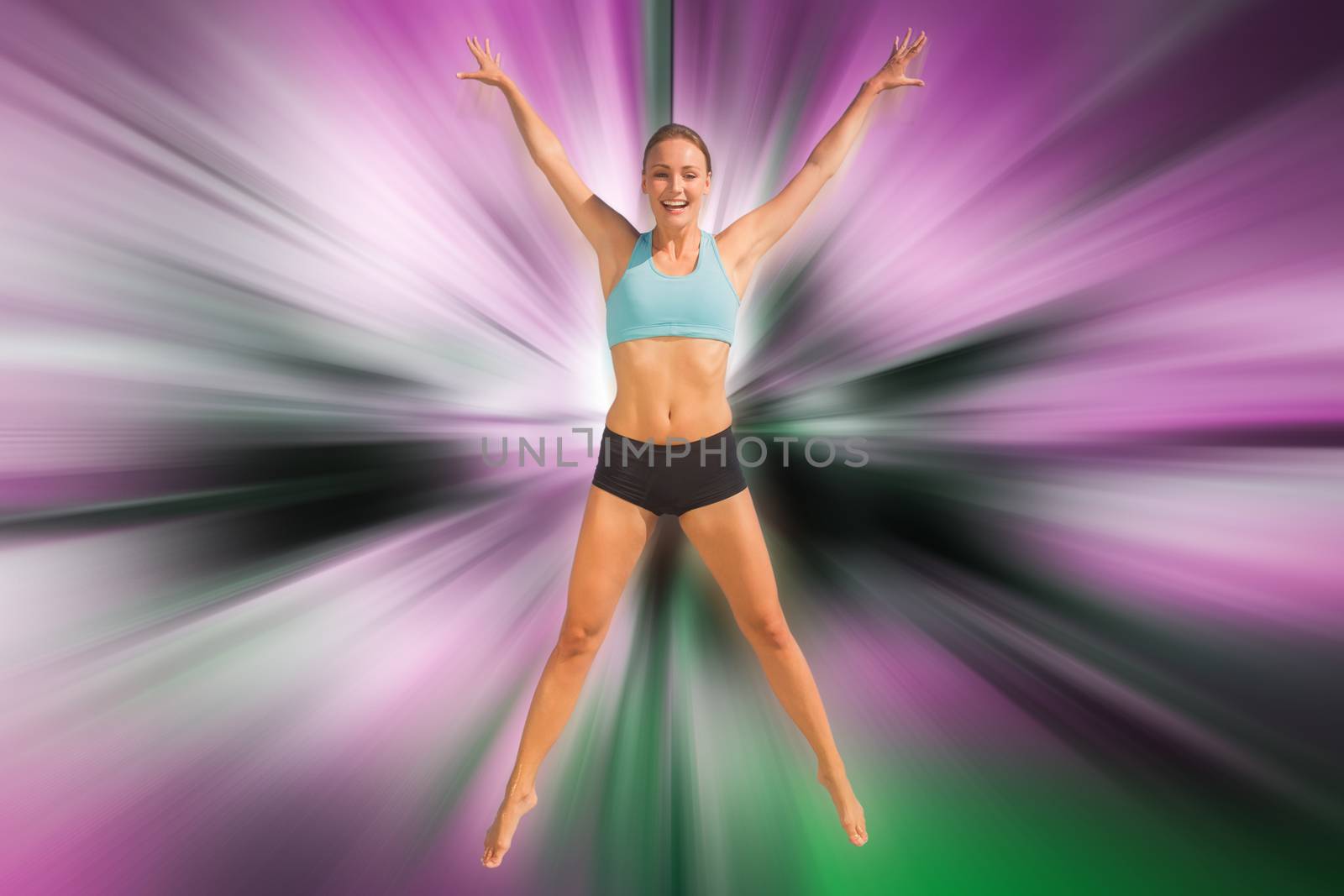 Composite image of fit woman jumping with arms out by Wavebreakmedia