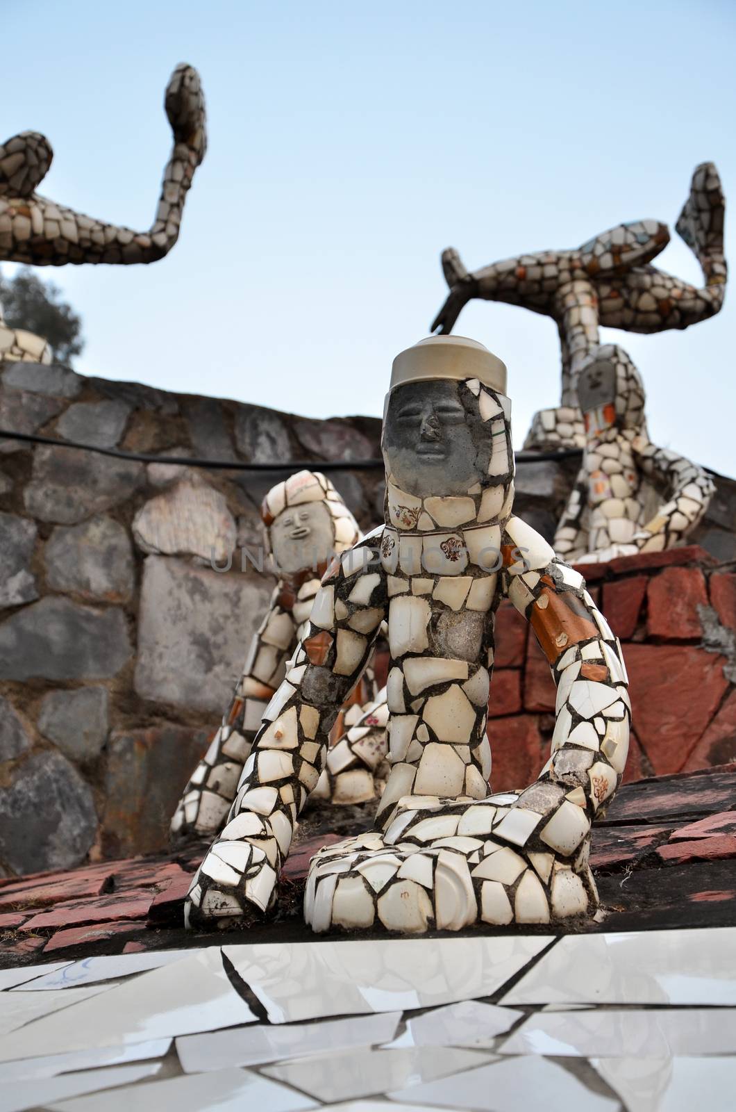 Chandigarh, India - January 4, 2015: Rock statues at the rock garden on January 4, 2015 in Chandigarh, India. The rock garden was founded by artist Nek Chand in 1957 and is made completely of recycled waste.