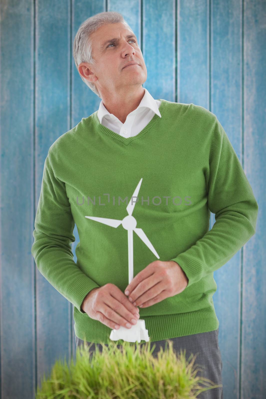 Composite image of man thinking about wind turbines by Wavebreakmedia