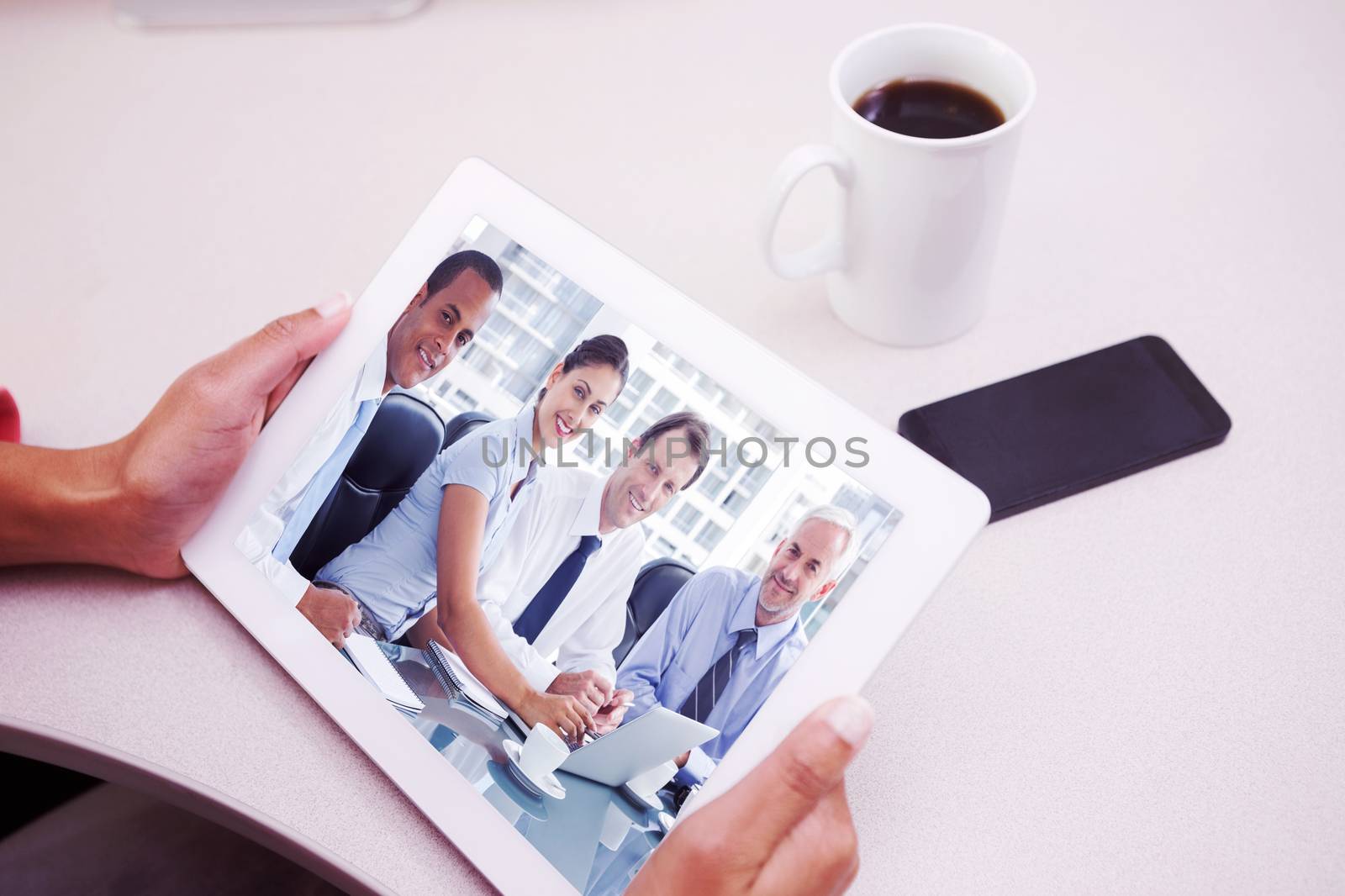 Woman using tablet pc  against business people brainstorming 