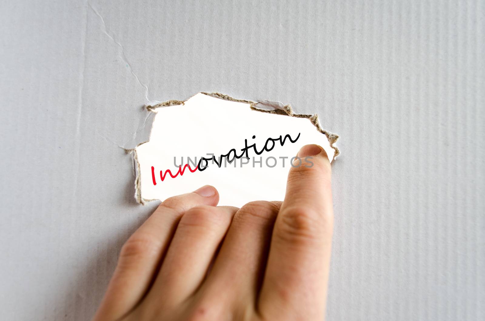 Hand on the cardboard background innovation concept