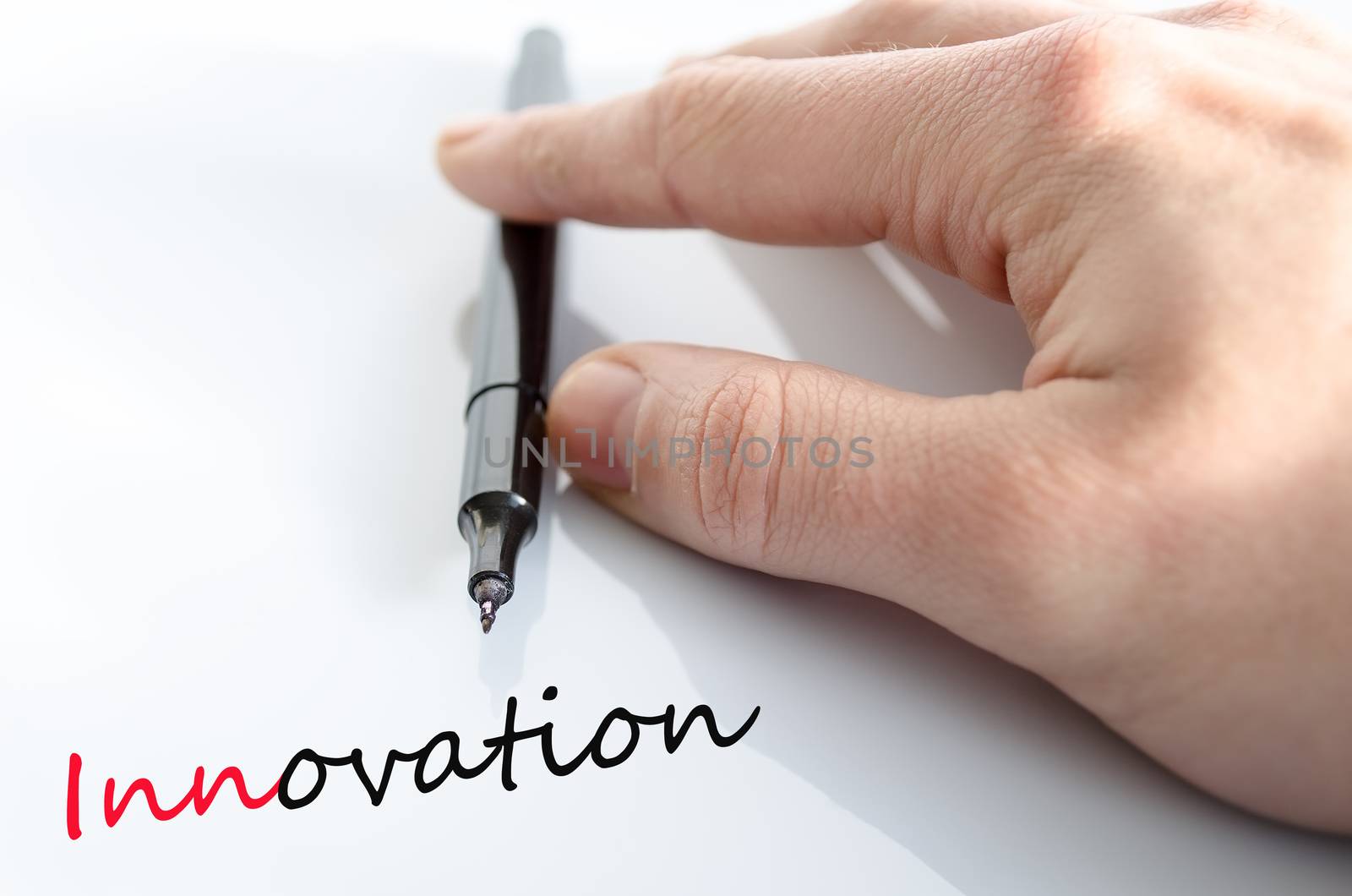 Pen in the hand isolated over white background innovation concept