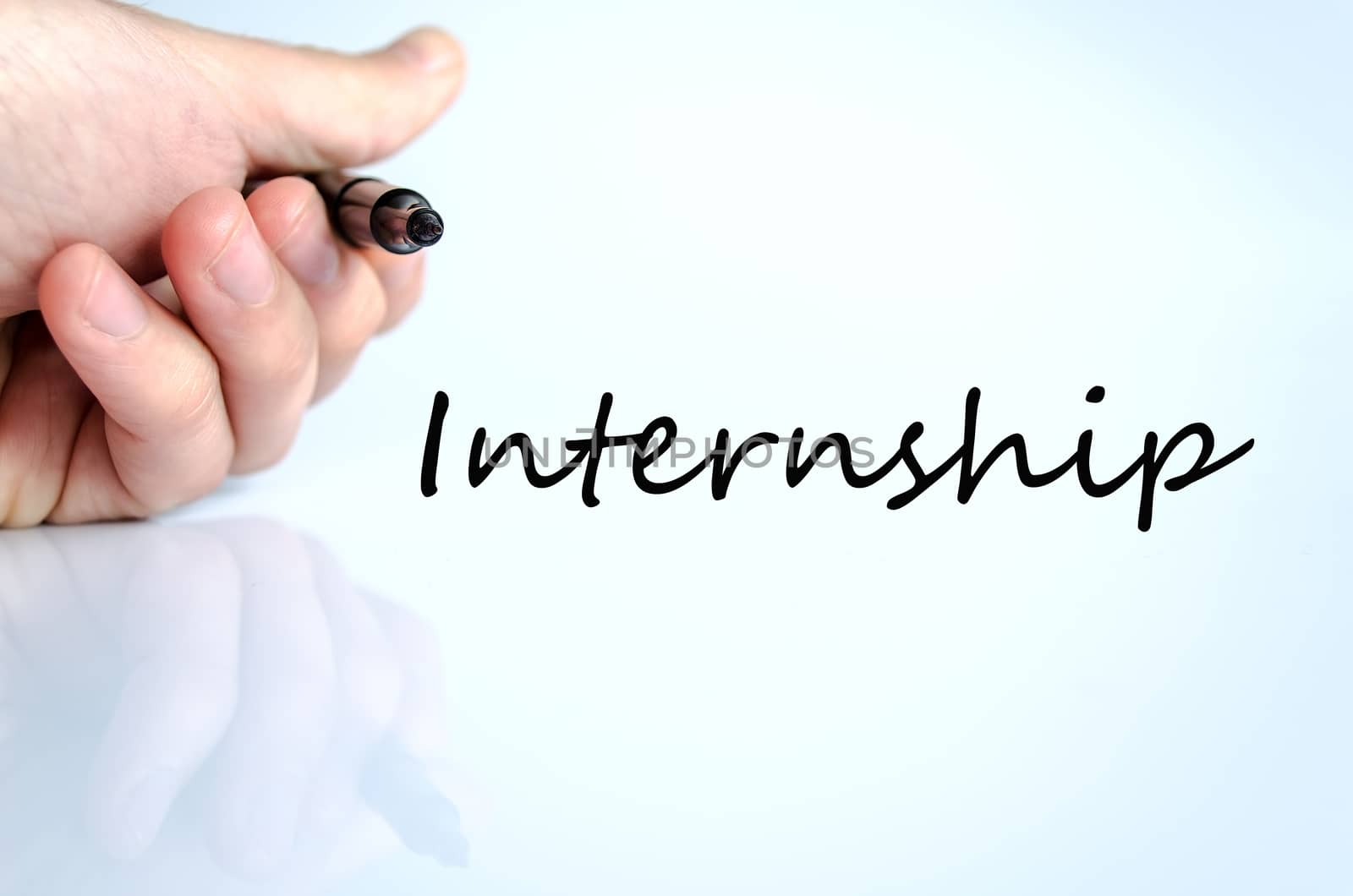 Pen in the hand isolated over white background internship concept