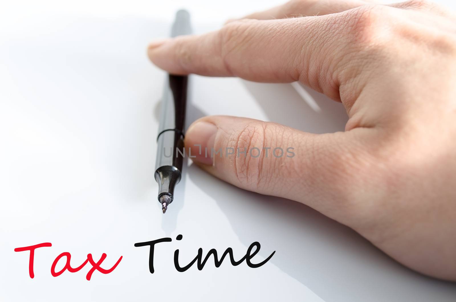 Pen in the hand isolated over white background tax time concept