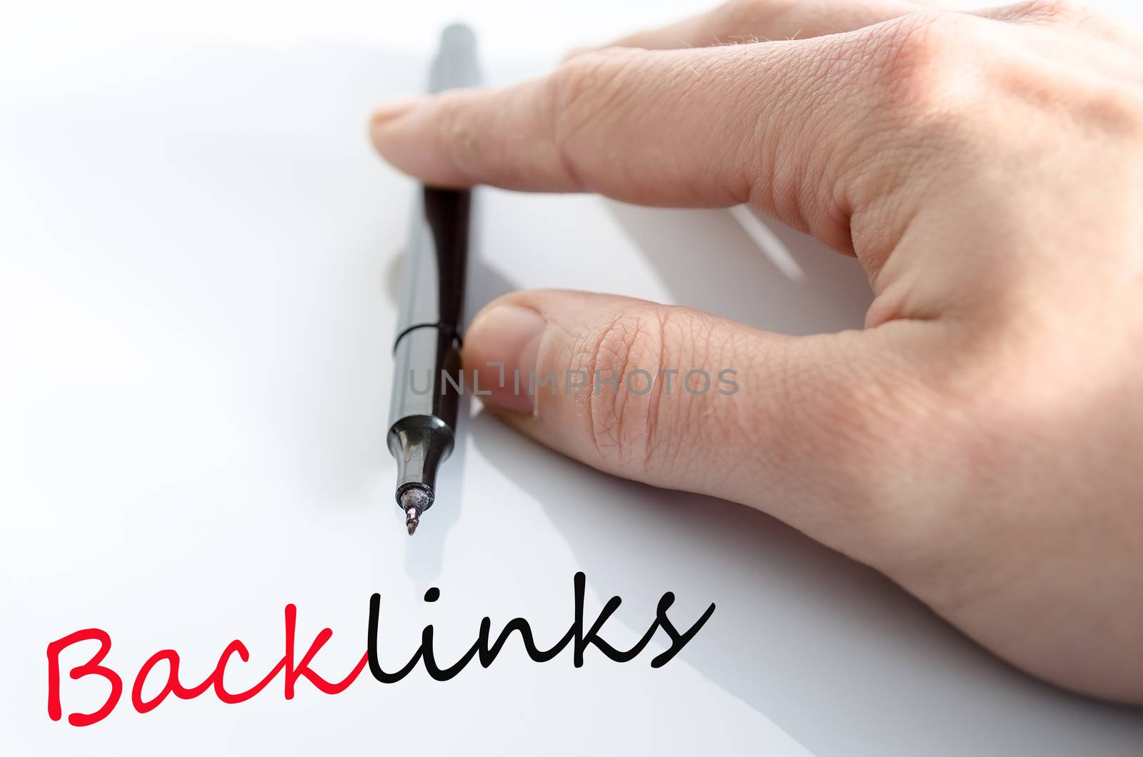 Pen in the hand isolated over white background backlinks concept