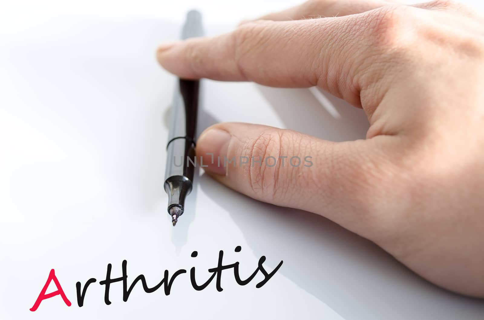 Pen in the hand isolated over white background arthritis concept