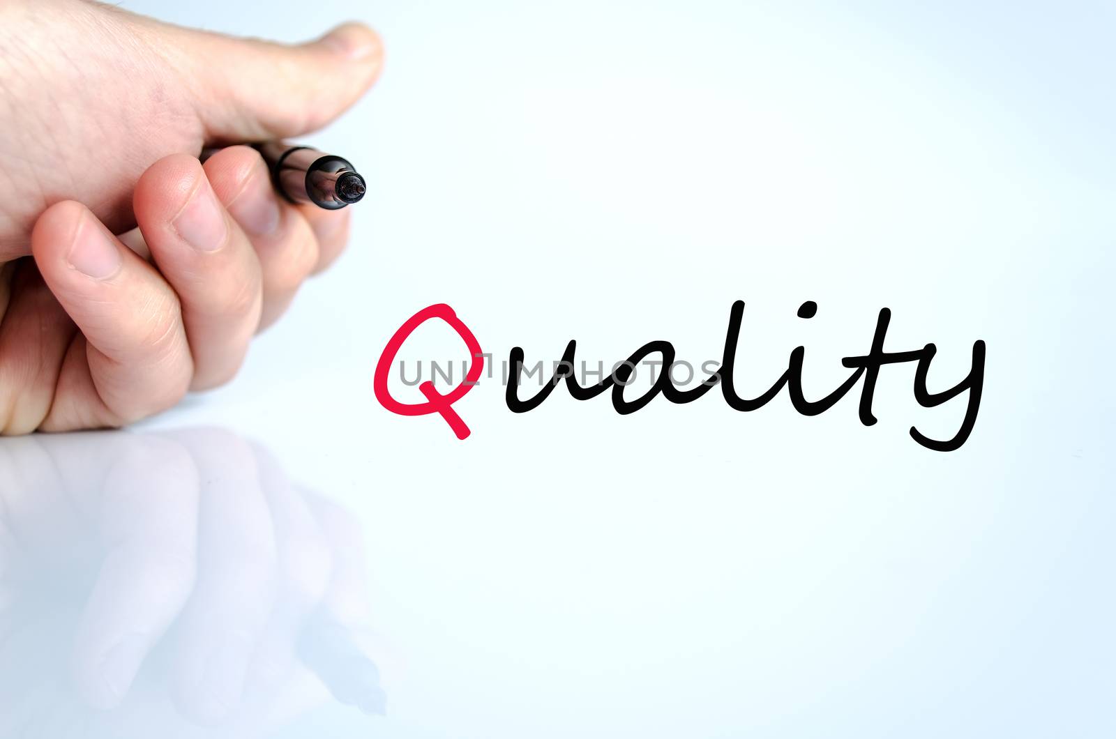 Pen in the hand isolated over white background quality concept