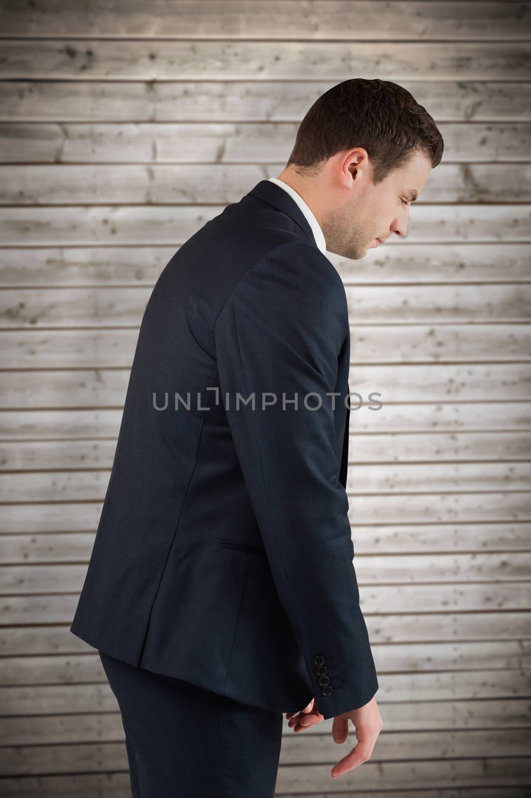 Composite image of businessman bowing by Wavebreakmedia