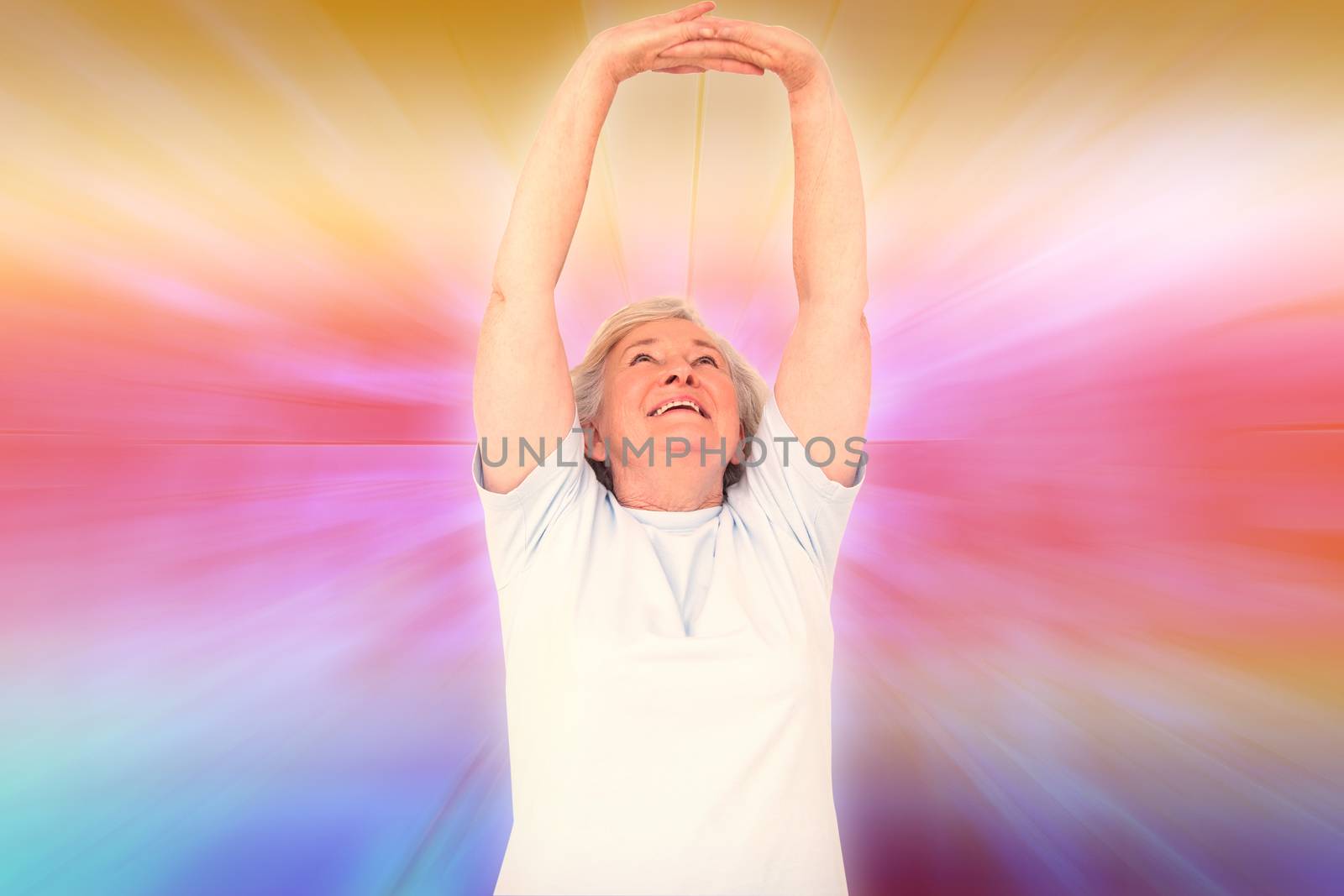 Composite image of senior woman stretching her arms by Wavebreakmedia