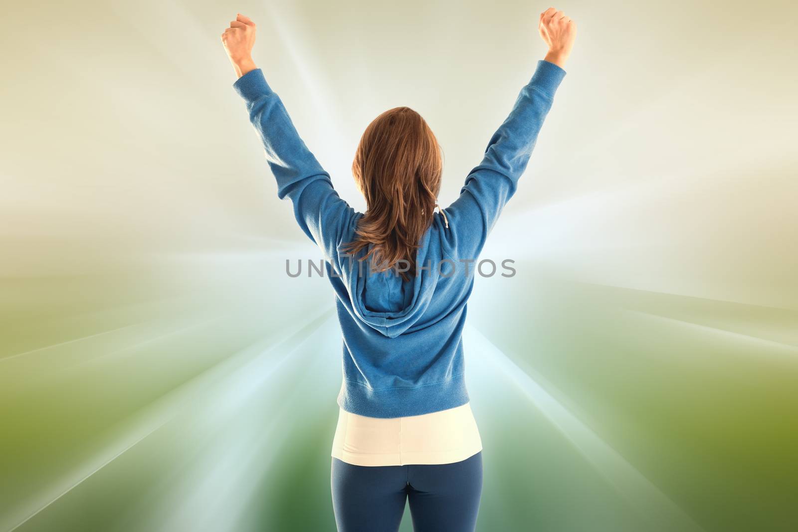 Cheering fit woman against abstract background