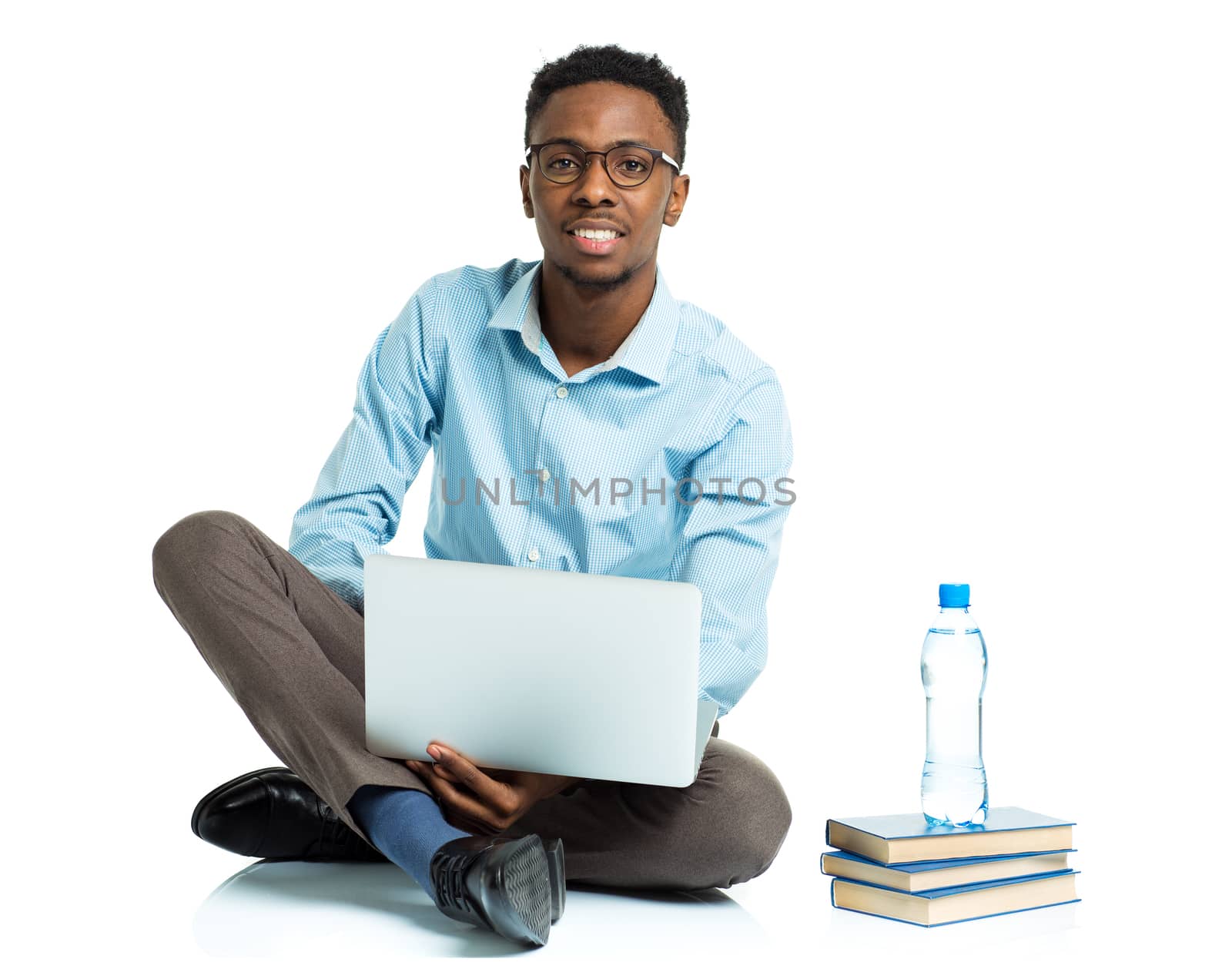 Happy african american college student with laptop, books and bo by vlad_star