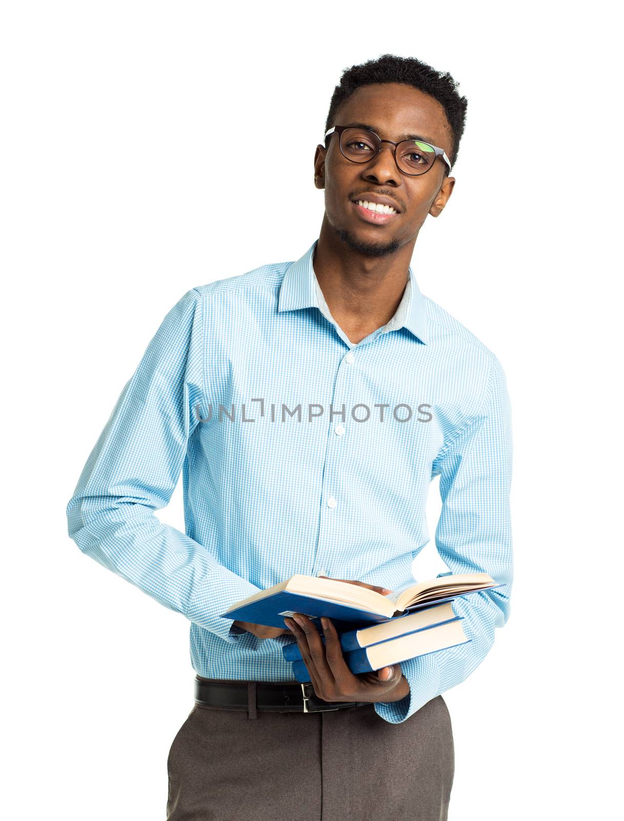 African american college student with books and bottle of water in his hands standing on white background