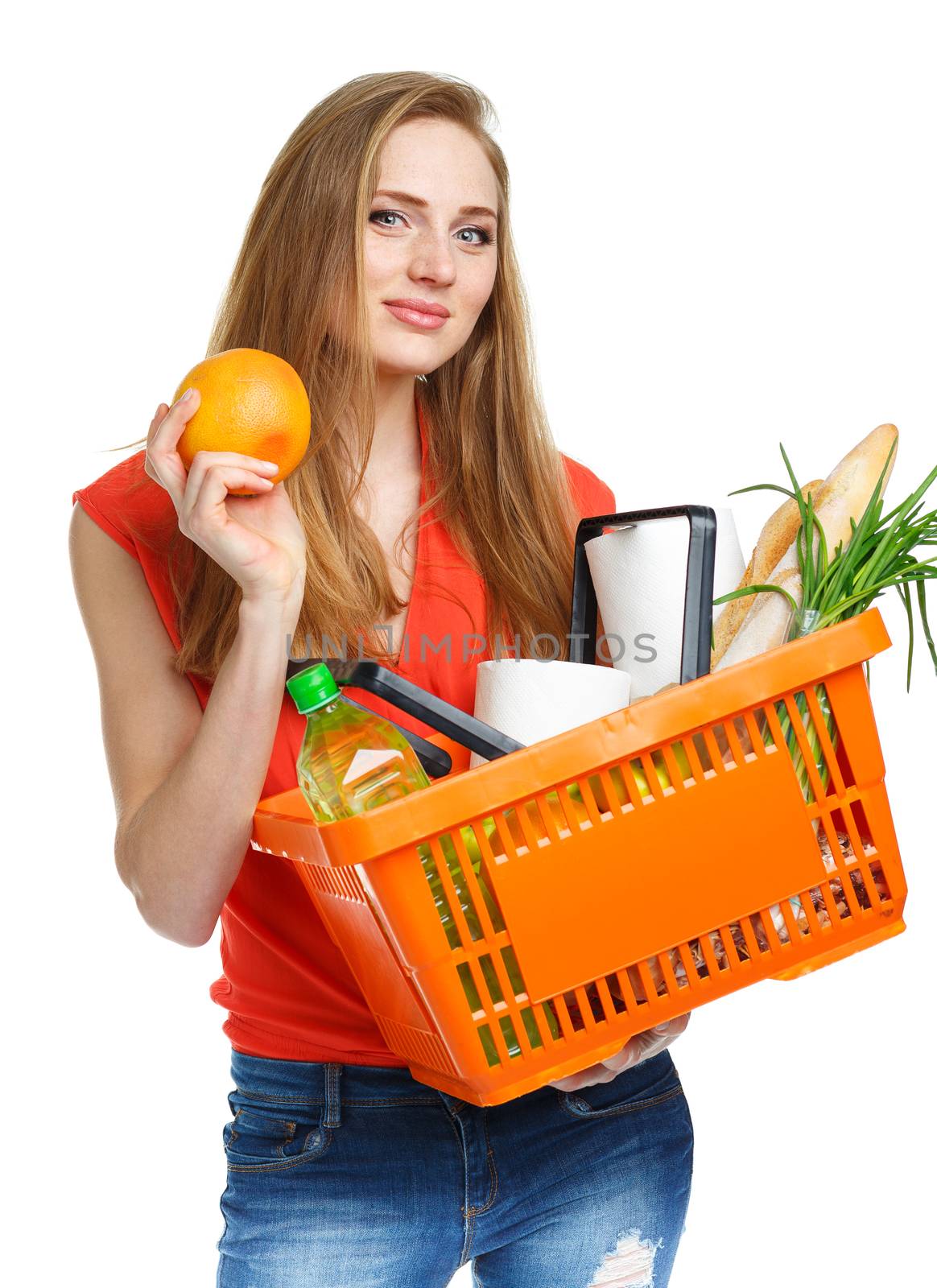 Happy young woman holding a basket full of healthy food on white by vlad_star