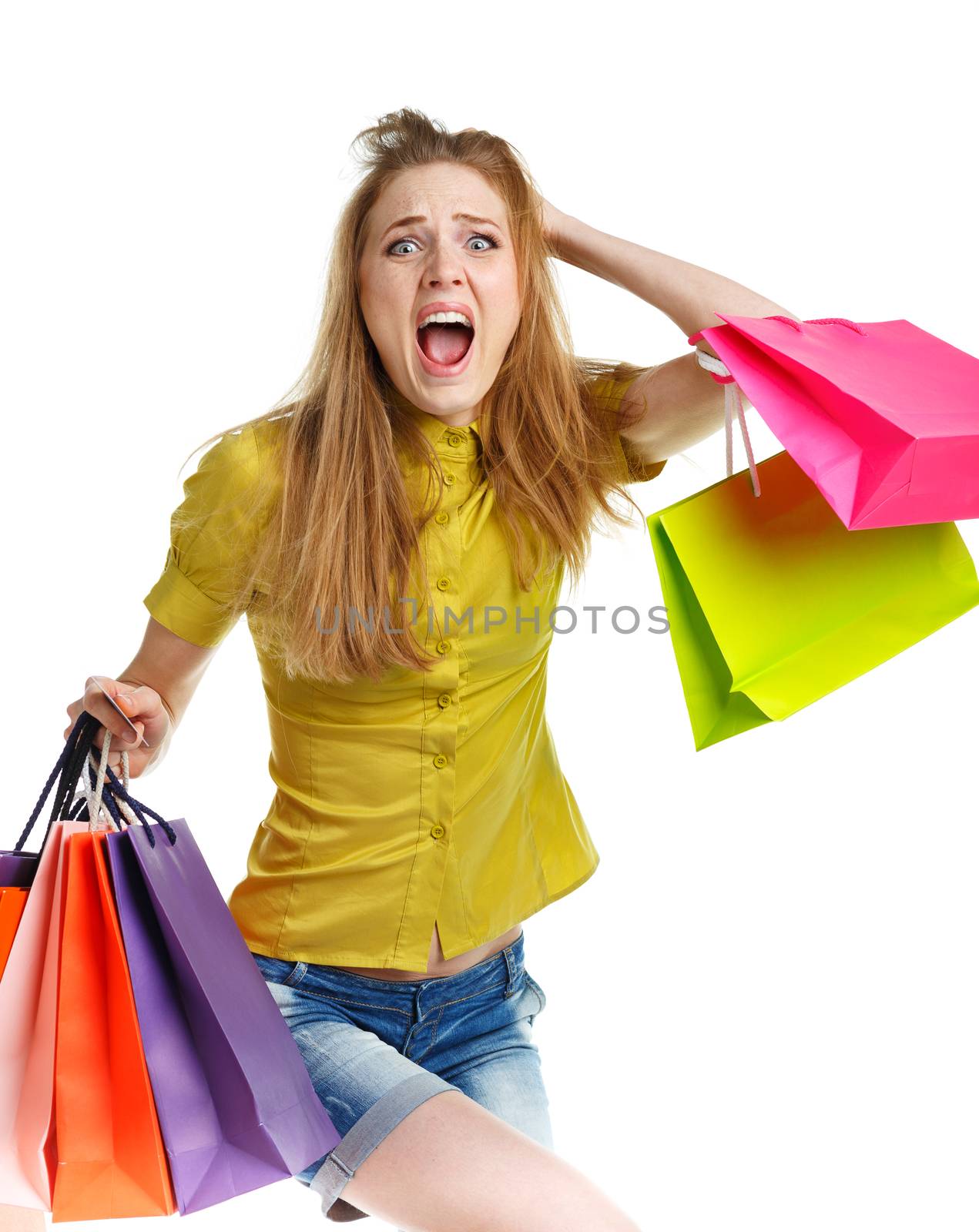 Emotional lovely woman with shopping bags over white background