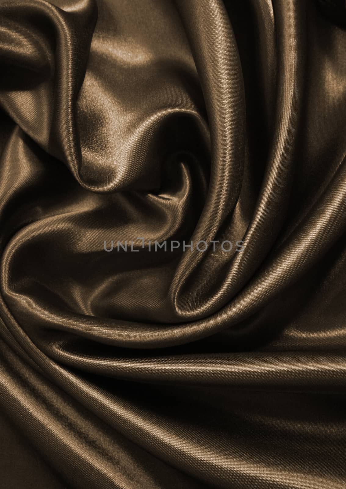 Smooth elegant golden silk or satin as background. In Sepia tone by oxanatravel