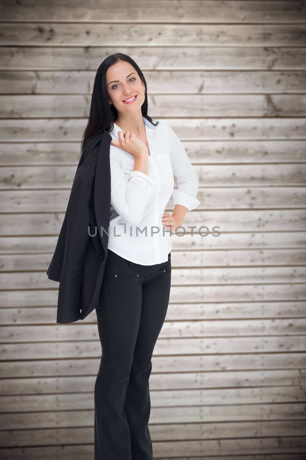 Composite image of pretty businesswoman smiling at camera by Wavebreakmedia