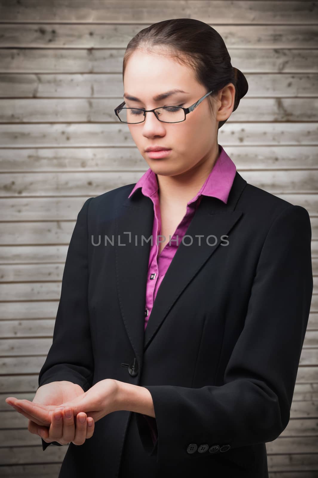 Businesswomans holding hands out against wooden planks background