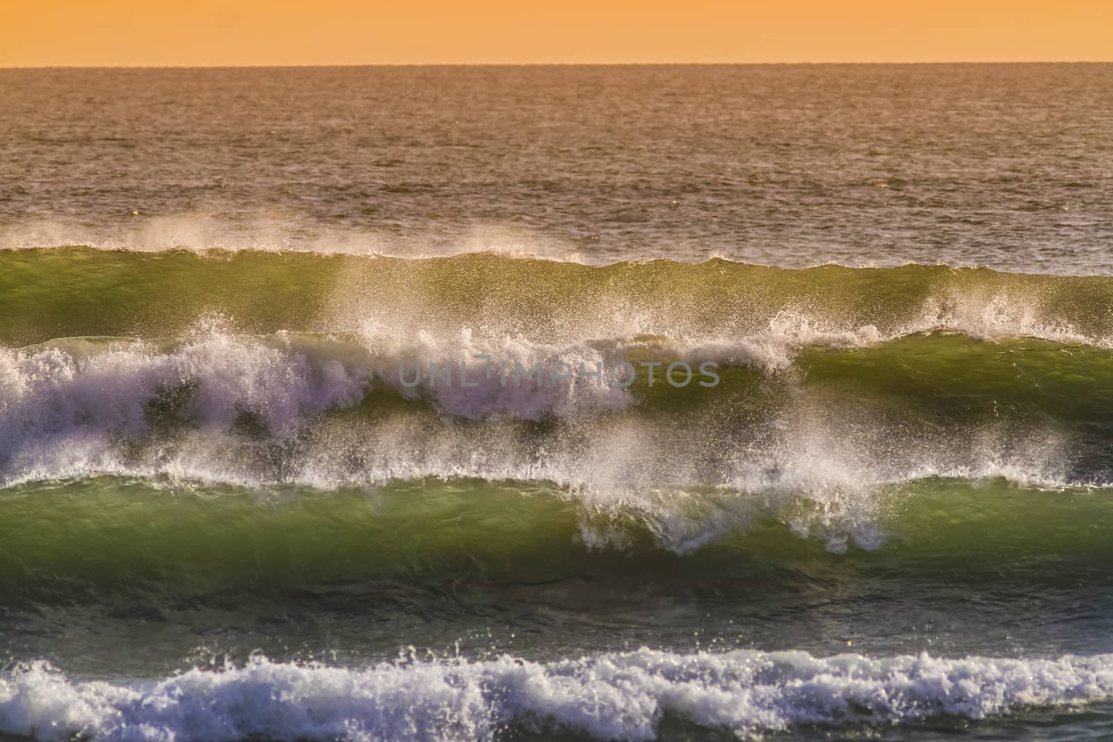 Sunrise and Shining Waves in Ocean by truphoto