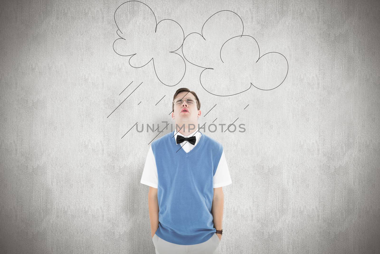 Geeky hipster looking up sadly against white background
