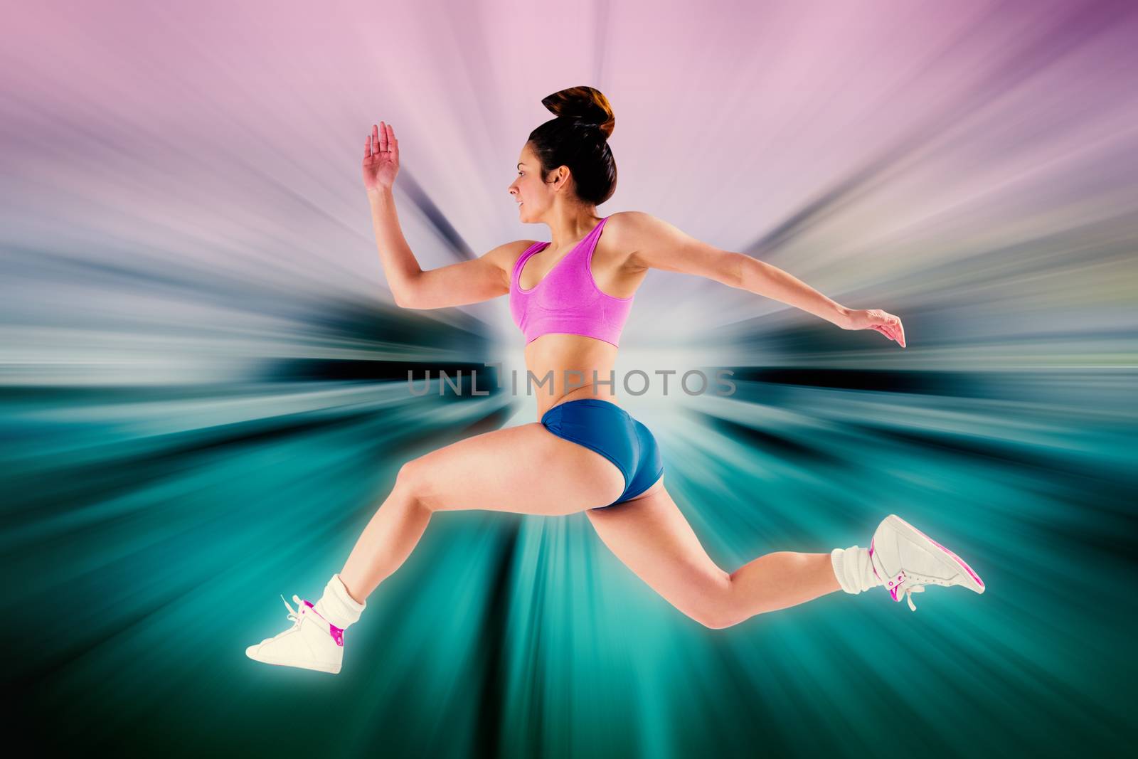 Fit brunette running and jumping against abstract background