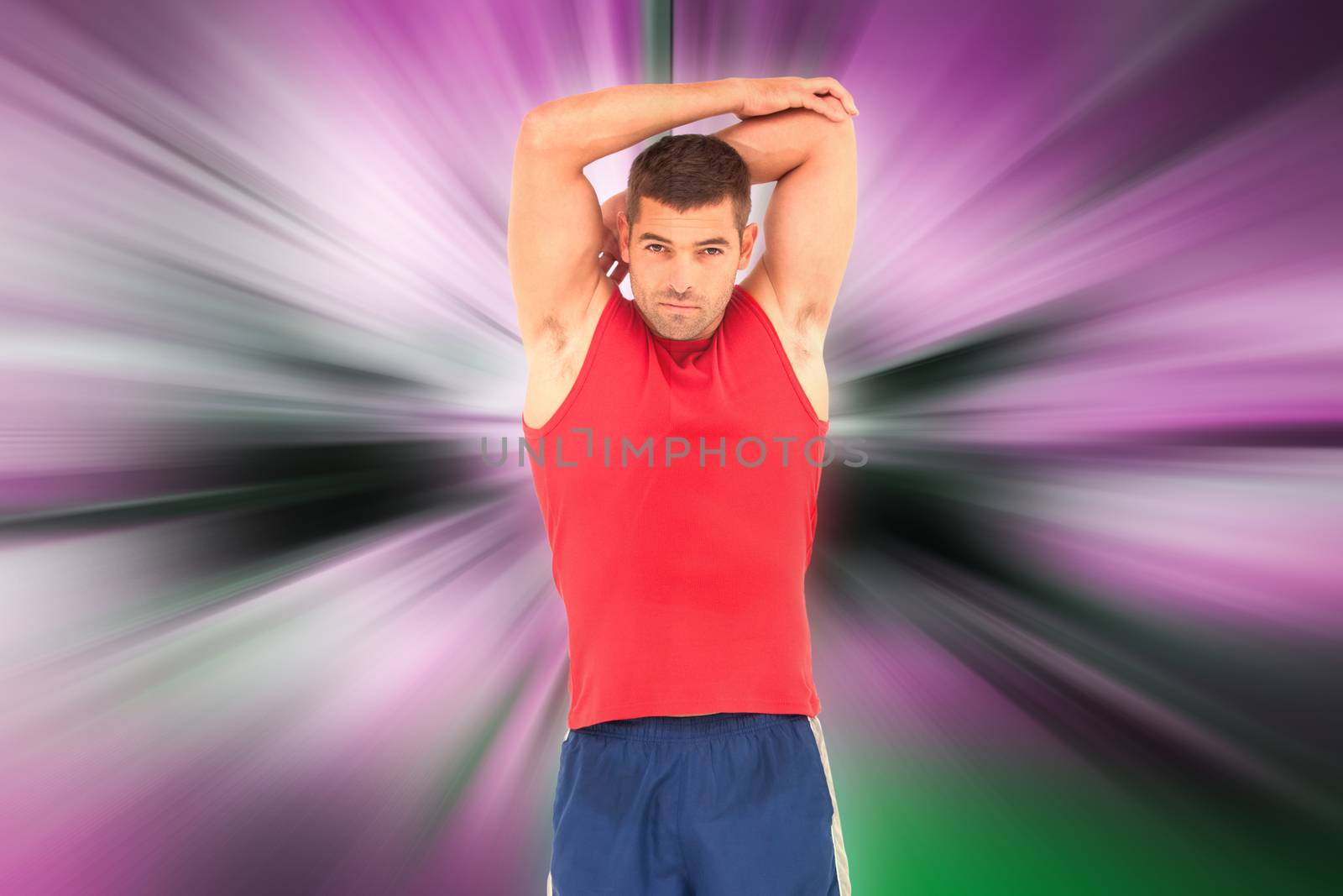 Fit man stretching his arms against abstract background