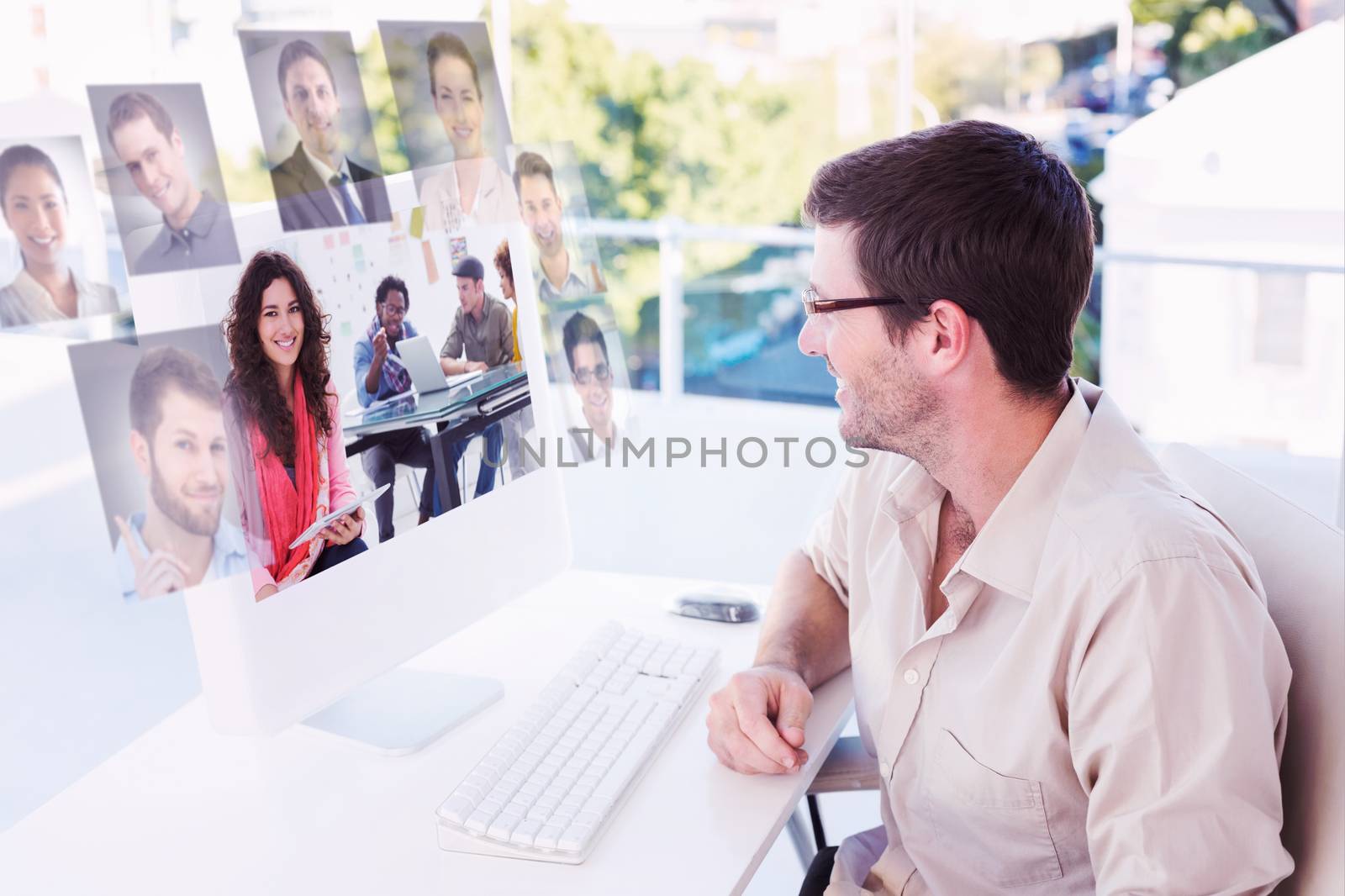 Smiling designer using tablet against profile pictures