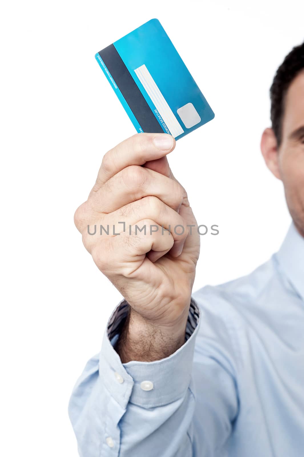 Cropped image of businessman showing credit card